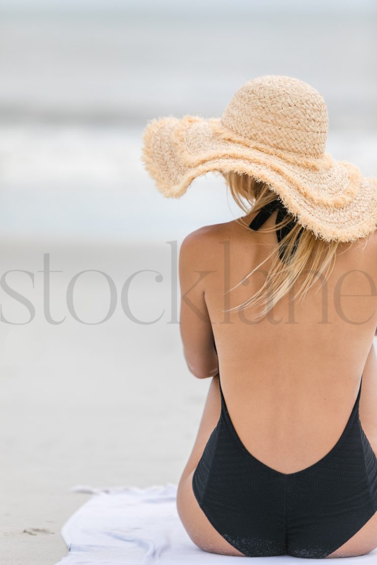 Vertical stock photo of woman at the beach