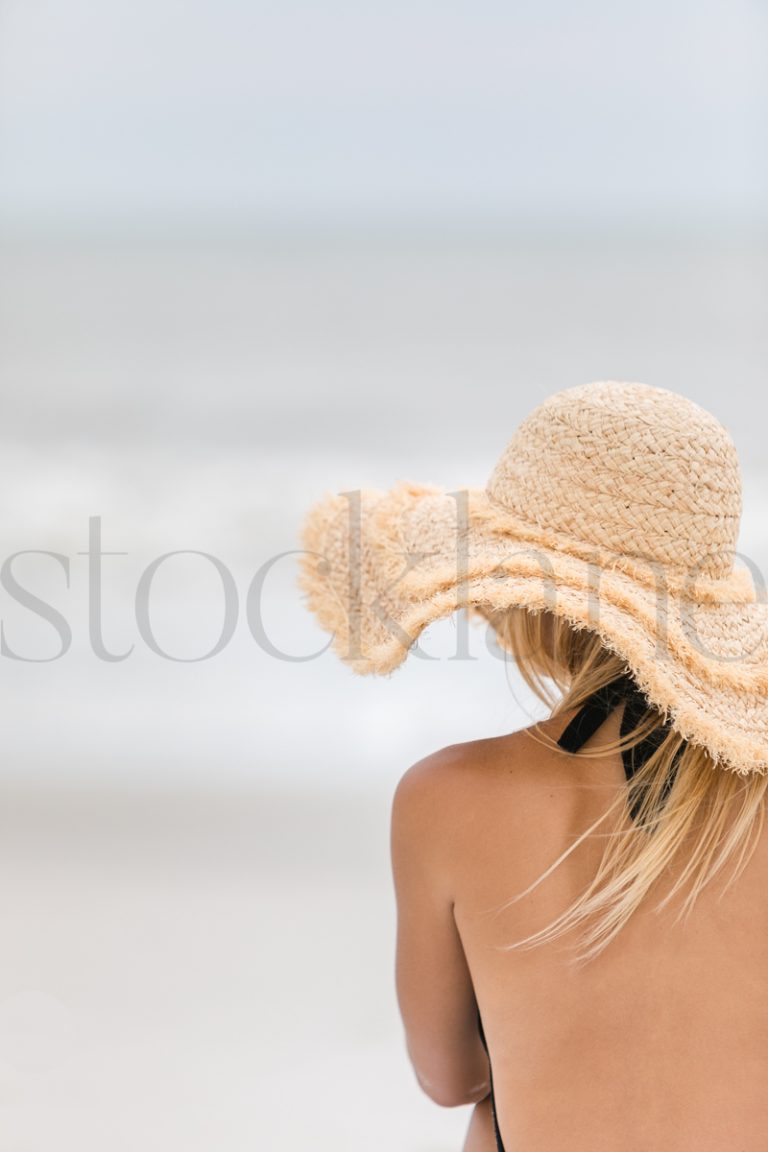 Vertical stock photo of woman at the beach