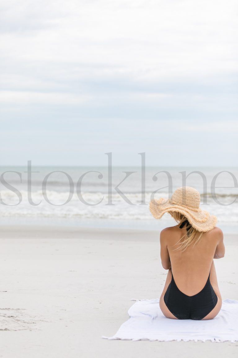 Vertical stock photo of women on the beach