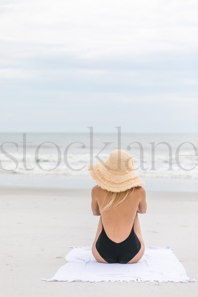 Vertical stock photo of women on the beach