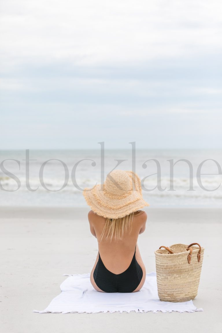 Vertical stock photo of women on the beach