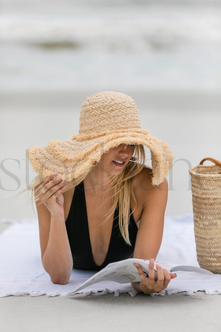 Vertical stock photo of women on the beach