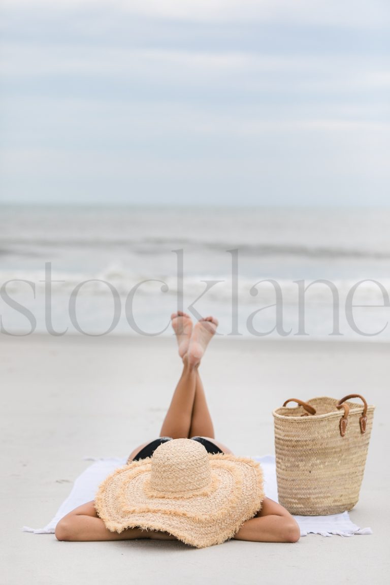 Vertical stock photo of women on the beach