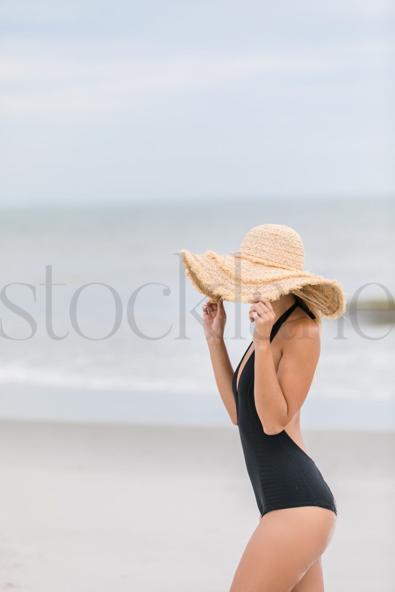 Vertical stock photo of women on the beach