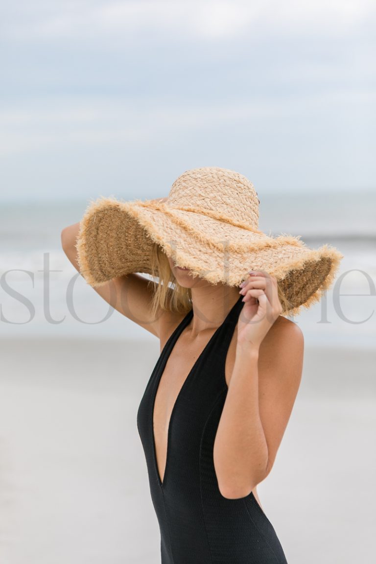 Vertical stock photo of women on the beach