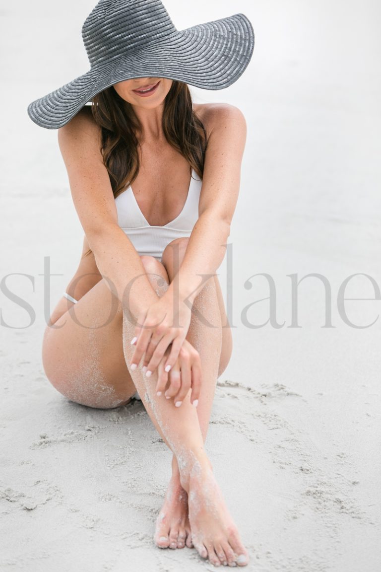 Vertical stock photo of women on the beach