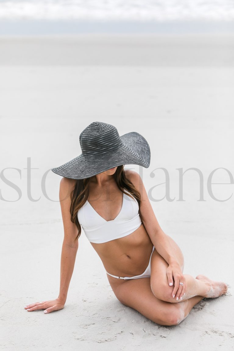 Vertical stock photo of women on the beach