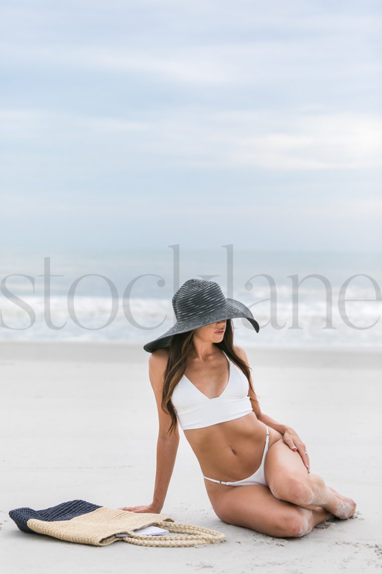 Vertical stock photo of women on the beach