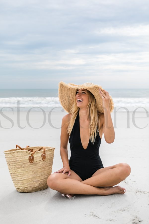 Vertical stock photo of women on the beach