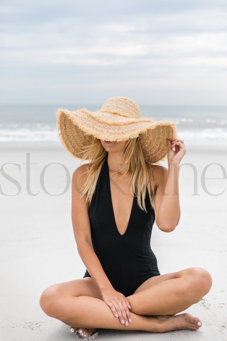 Vertical stock photo of women on the beach