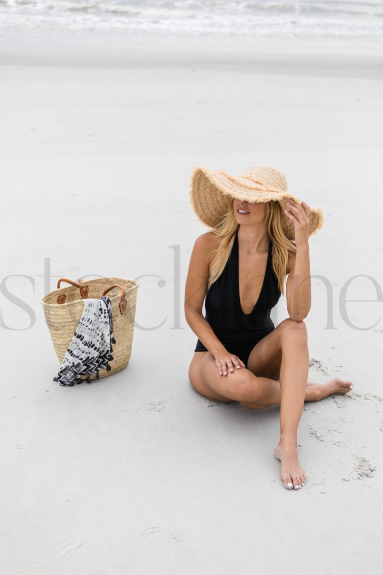 Vertical stock photo of women on the beach