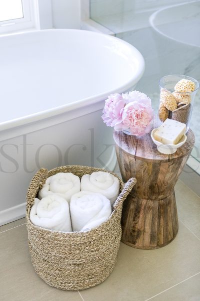 Vertical stock photo of bathtub and accessories