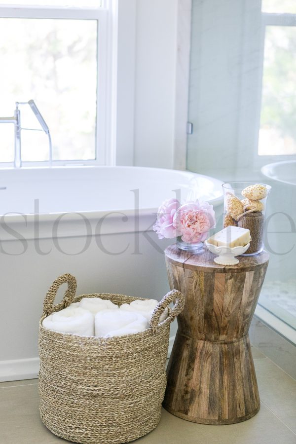 Vertical stock photo of bathtub and accessories