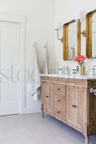 Vertical stock photo of vanity with peonies