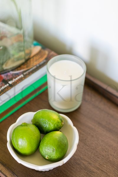 Vertical Stock photo of limes and a candle