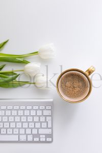 Vertical stock photo of feminine desktop