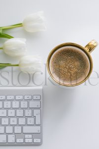 Vertical stock photo of feminine desktop