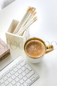 Vertical stock photo of feminine desktop