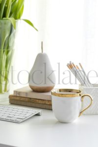 Vertical stock photo of feminine desktop