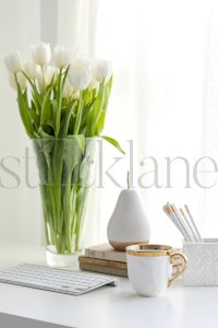 Vertical stock photo of feminine desktop