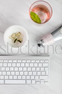 Vertical stock photo of lotion and keyboard