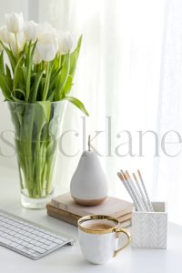 Vertical stock photo of feminine desktop