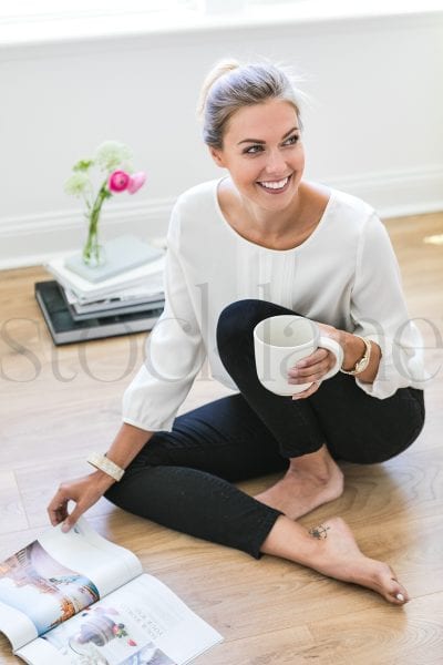 Vertical stock photo of woman with coffee