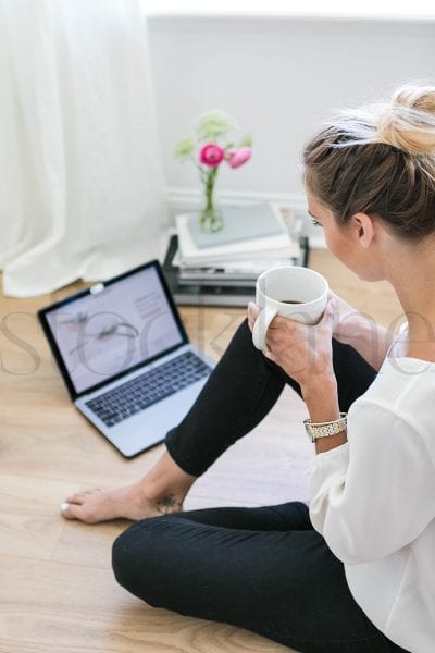 Vertical stock photo of woman with coffee