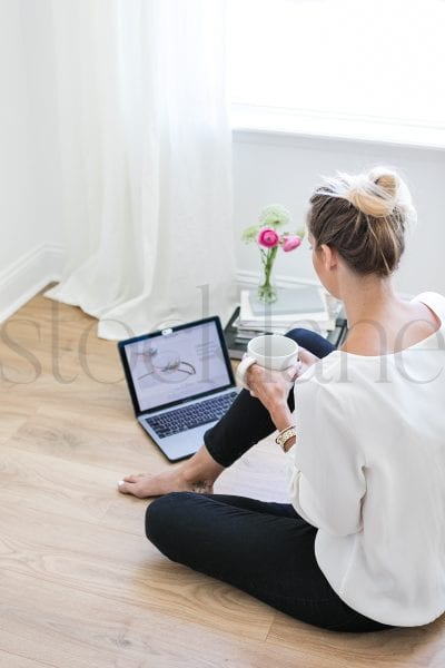 Vertical stock photo of woman with coffee