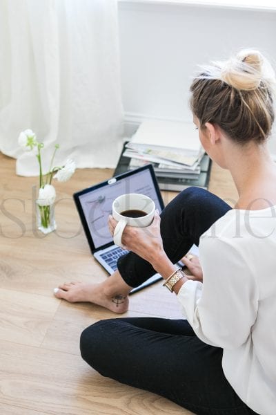 Vertical stock photo of woman with coffee