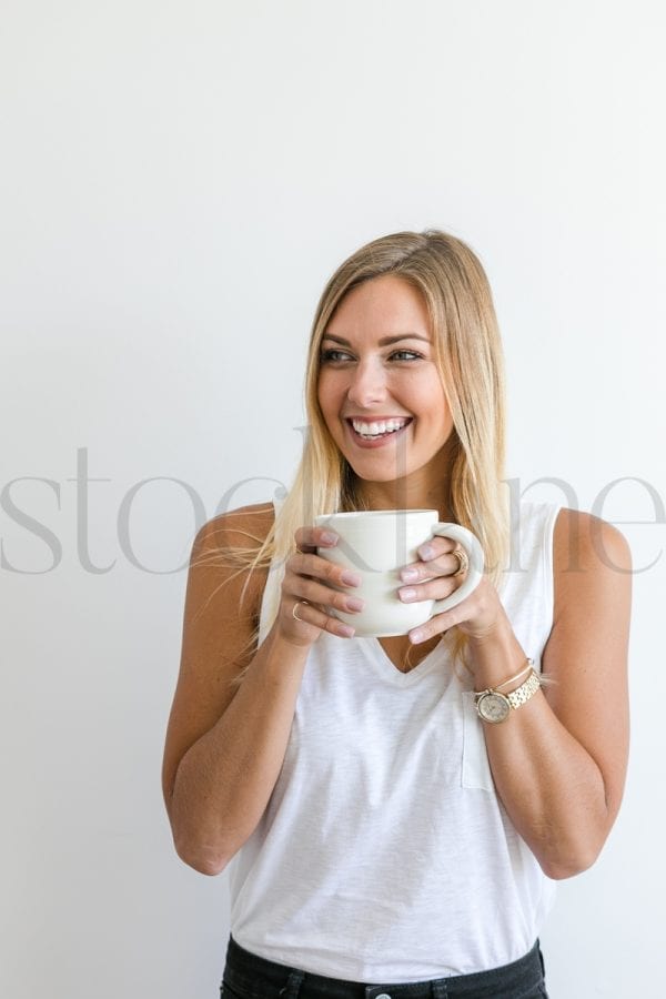 Vertical stock photo of woman with coffee