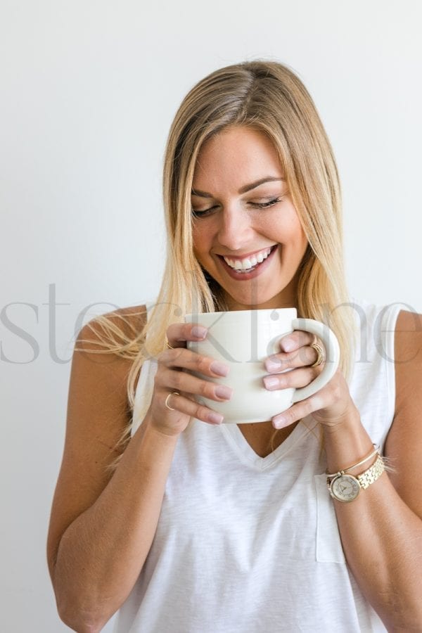 Vertical stock photo of woman with coffee