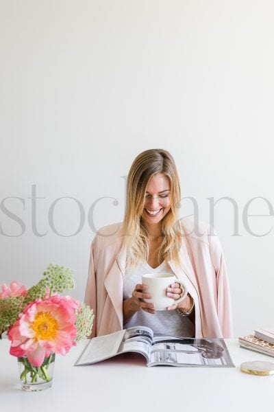 Vertical stock photo of woman with coffee