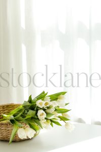 Vertical stock photo of flowers in basket