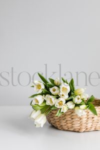 Vertical stock photo of flowers in basket