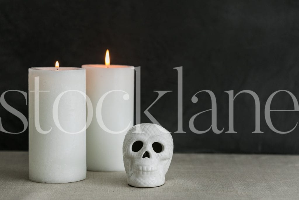 Horizontal image of candles and skull for Halloween