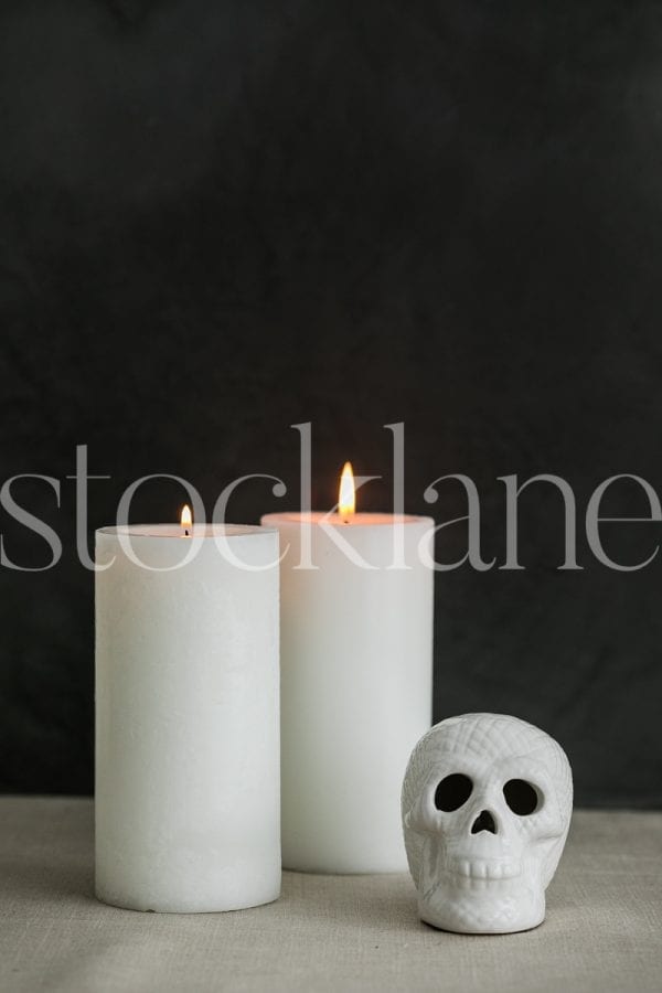 Vertical stock photo of Halloween skull and candles