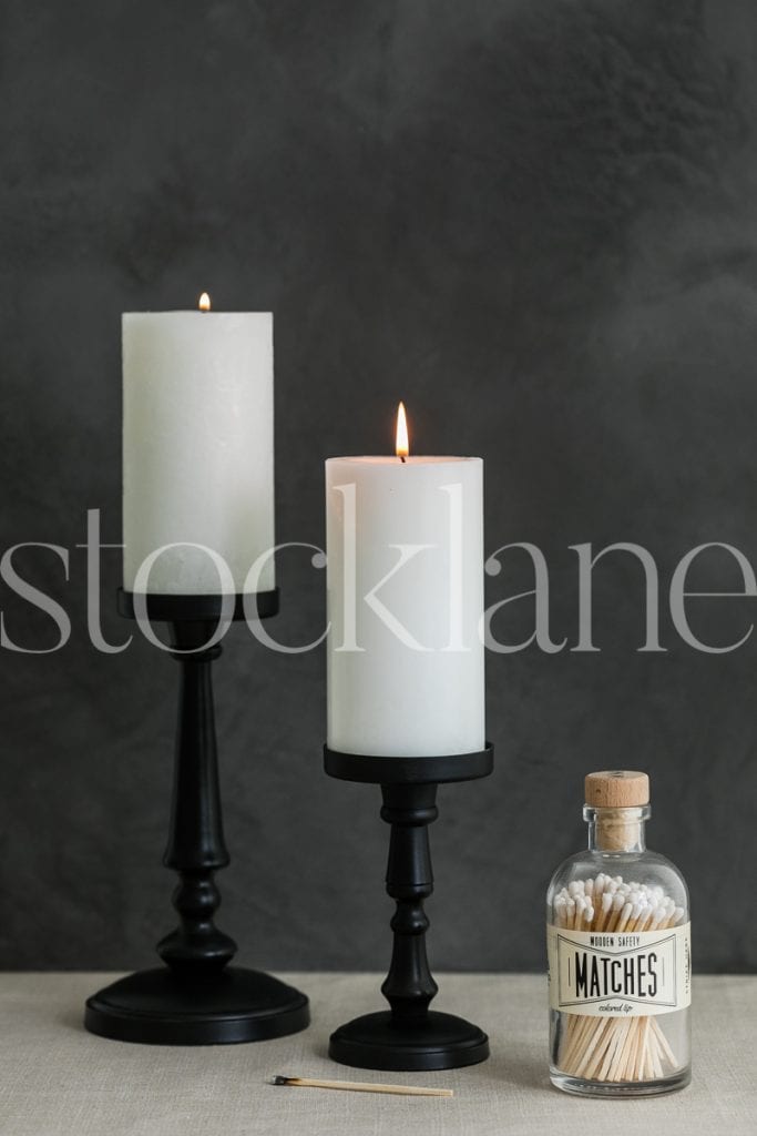 Vertical Halloween stock photo of white candles and matches