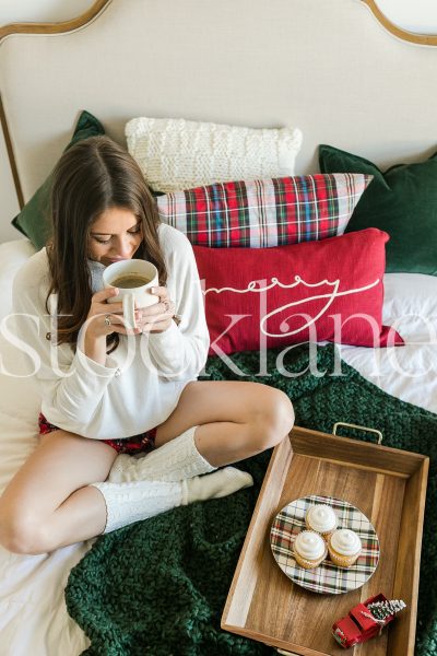 Vertical stock photo of Christmas breakfast in bed