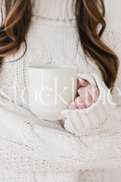 Vertical stock photo of woman holding cup