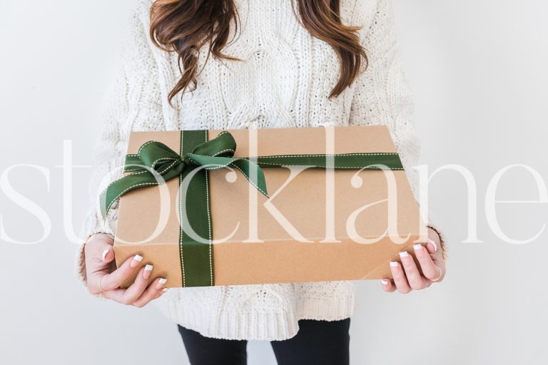 Horizontal stock photo of woman holding gift