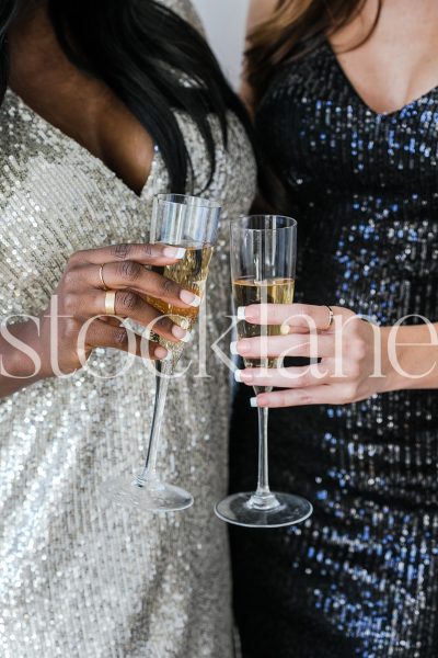 Vertical stock photo of women with champagne