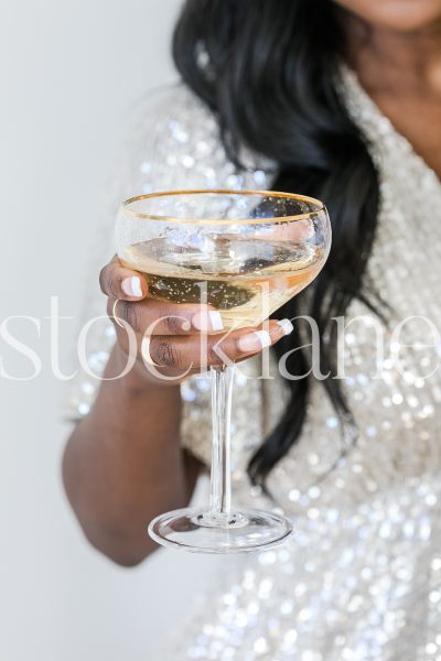 Vertical stock photo of woman with champagne glass