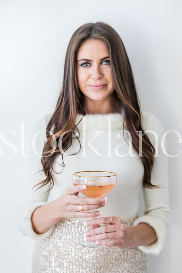 Vertical stock photo of woman with champagne glass