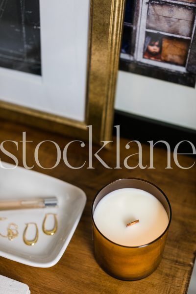 Vertical stock photo of candle in desk