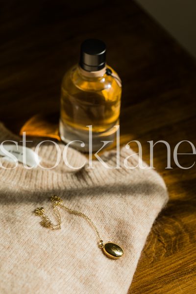 Vertical stock photo of woman sweater and accessories