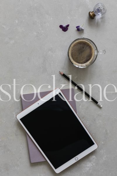 Vertical stock photo of iPad and coffee