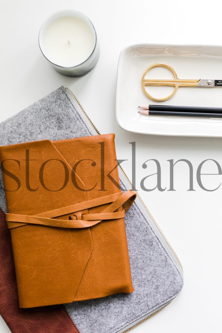 Vertical stock photo of journal in desk