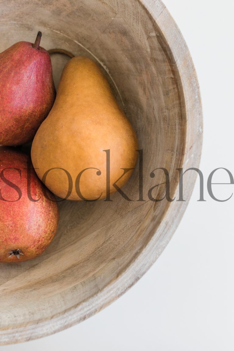 Vertical stock photo of pears in a bowl