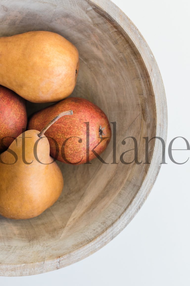 Vertical stock photo of pears in a bowl